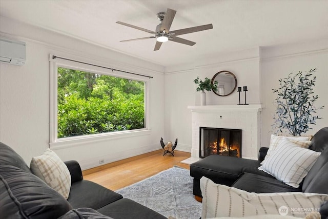 1305 N 6th St, Tacoma, WA 98403 - living room with wood finished floors, a brick fireplace, ceiling fan, and an AC wall unit
