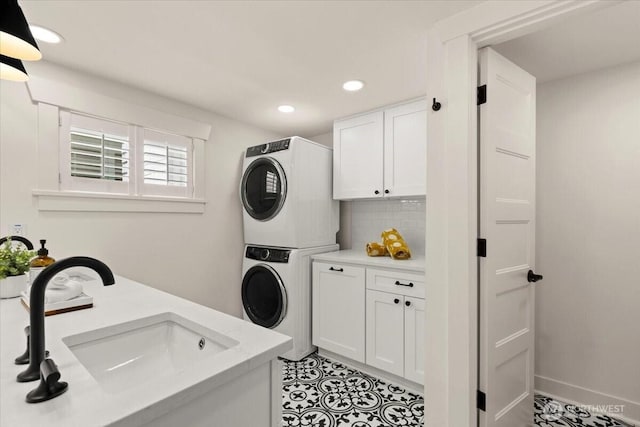 1305 N 6th St, Tacoma, WA 98403 - laundry area with stacked washer and clothes dryer, cabinet space, recessed lighting, and light tile patterned flooring