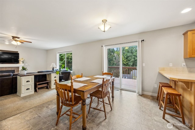 17712 E Clear Lake Blvd SE, Yelm, WA 98597 - dining area with a ceiling fan and a tiled fireplace