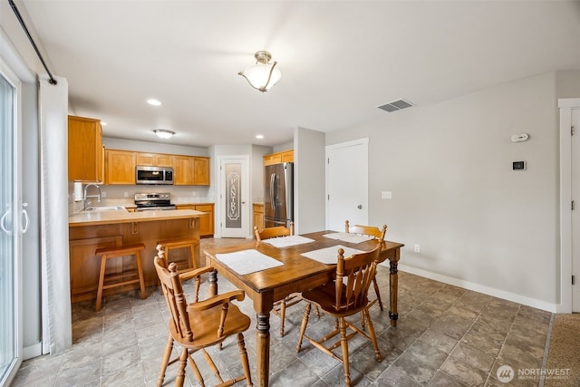 17712 E Clear Lake Blvd SE, Yelm, WA 98597 - dining space with recessed lighting and stone finish floors