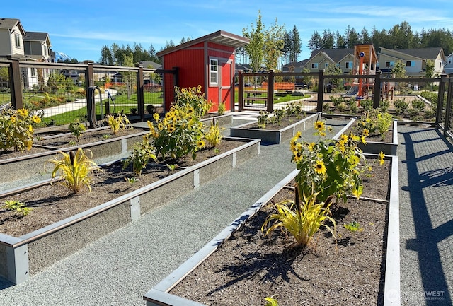 33025 Evergreen Ave SE, Black Diamond, WA 98010 - view of playground with a vegetable garden, a storage unit, and a residential view