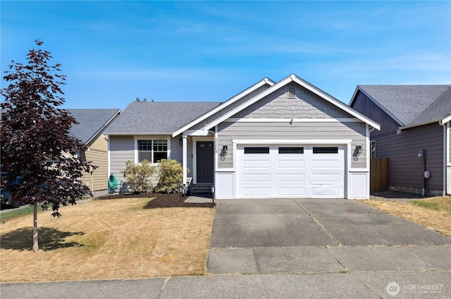 20008 99th Ave E, Graham, WA 98338 - single story home with driveway, an attached garage, a front lawn, and a shingled roof