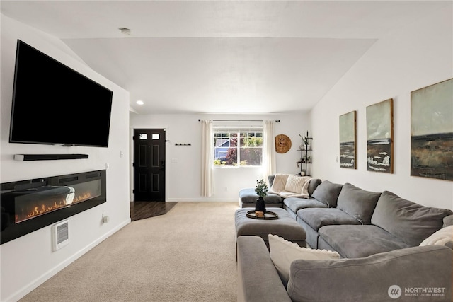 20008 99th Ave E, Graham, WA 98338 - carpeted living area featuring vaulted ceiling, a glass covered fireplace, and recessed lighting