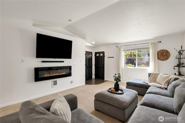 20008 99th Ave E, Graham, WA 98338 - living area with carpet flooring, a glass covered fireplace, and lofted ceiling