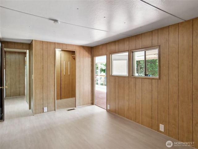 9128 184th Ave NE, Granite Falls, WA 98252 - unfurnished room featuring wooden walls, wood finished floors, and a smoke detector