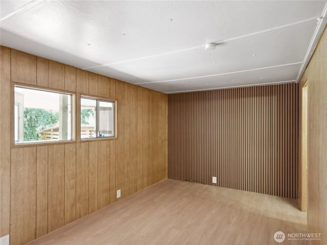 9128 184th Ave NE, Granite Falls, WA 98252 - spare room featuring wood walls, wood finished floors, and a smoke detector