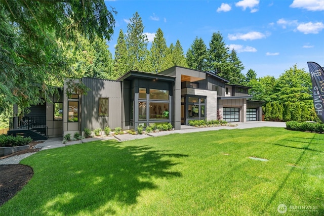 10230 SE 13th Pl, Bellevue, WA 98004 - back of house featuring concrete driveway, an attached garage, and a lawn