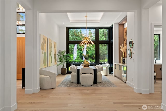 10230 SE 13th Pl, Bellevue, WA 98004 - dining space with a chandelier, light wood-style flooring, healthy amount of natural light, a towering ceiling, and recessed lighting