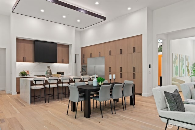 10230 SE 13th Pl, Bellevue, WA 98004 - dining area with a high ceiling, light wood-type flooring, and recessed lighting