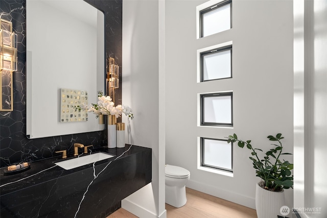10230 SE 13th Pl, Bellevue, WA 98004 - bathroom featuring wood finished floors, tasteful backsplash, vanity, and a towering ceiling