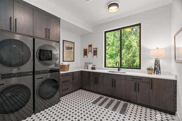 10230 SE 13th Pl, Bellevue, WA 98004 - washroom with cabinet space, stacked washer / drying machine, and light flooring