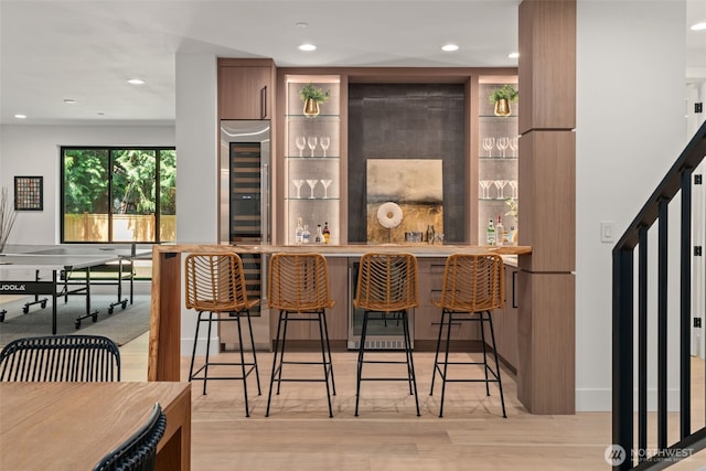 10230 SE 13th Pl, Bellevue, WA 98004 - indoor wet bar featuring wine cooler, recessed lighting, and light wood-type flooring