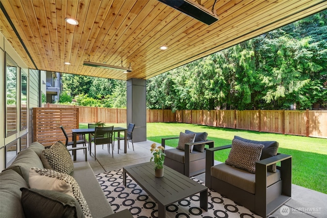 10230 SE 13th Pl, Bellevue, WA 98004 - fenced backyard featuring an outdoor hangout area, outdoor dining area, and a patio area