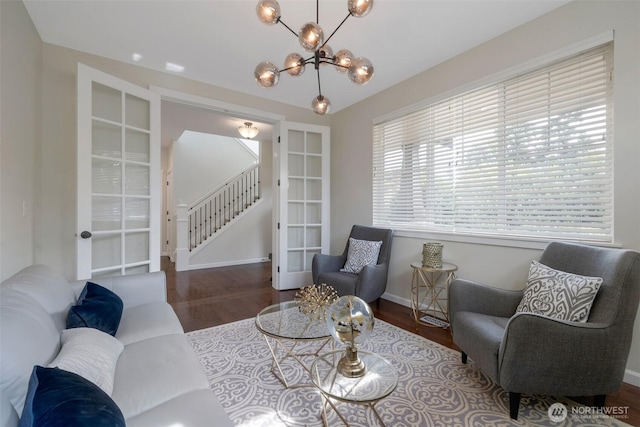 2504 NE 24th Pl, Renton, WA 98056 - living area with wood finished floors, stairway, and a chandelier