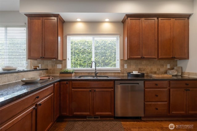 2504 NE 24th Pl, Renton, WA 98056 - kitchen with dishwasher, backsplash, dark stone counters, brown cabinets, and recessed lighting
