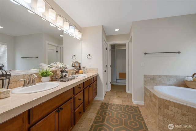 2504 NE 24th Pl, Renton, WA 98056 - bathroom with double vanity, a bath, and recessed lighting