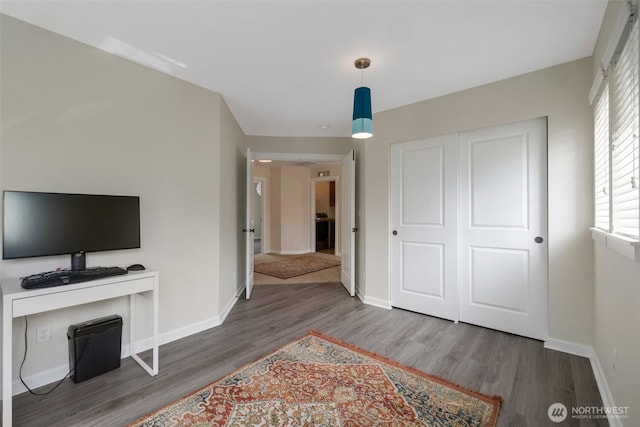 2504 NE 24th Pl, Renton, WA 98056 - unfurnished bedroom featuring wood finished floors, an office area, and a closet