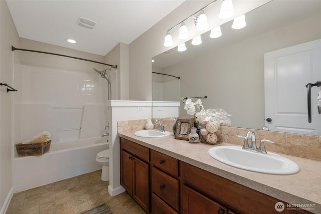 2504 NE 24th Pl, Renton, WA 98056 - bathroom featuring  shower combination, double vanity, and stone finish floors