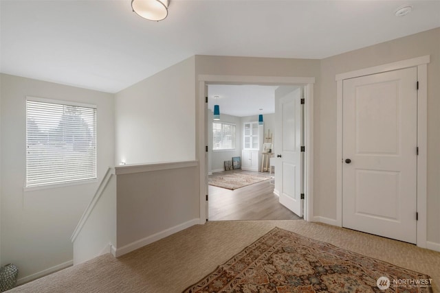 2504 NE 24th Pl, Renton, WA 98056 - corridor featuring carpet flooring and an upstairs landing