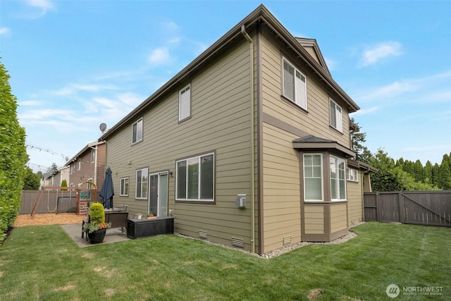 2504 NE 24th Pl, Renton, WA 98056 - rear view of property featuring a fenced backyard and a patio area