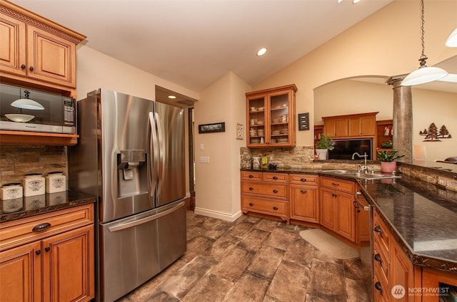 1483 Fox Hollow Rd, Sequim, WA 98382 - kitchen with stainless steel appliances, brown cabinets, backsplash, lofted ceiling, and recessed lighting