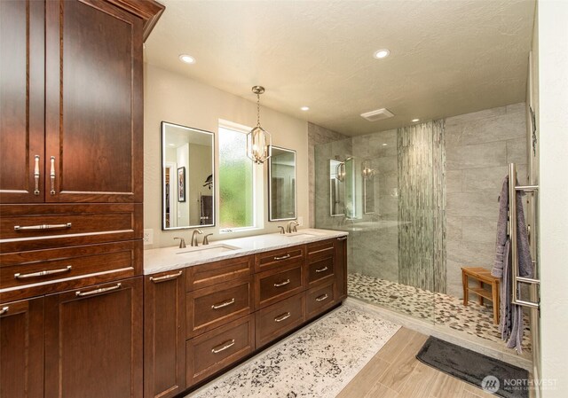 1483 Fox Hollow Rd, Sequim, WA 98382 - bathroom featuring walk in shower, double vanity, recessed lighting, and a chandelier