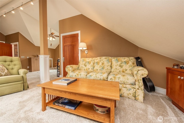 1483 Fox Hollow Rd, Sequim, WA 98382 - carpeted living room with vaulted ceiling, track lighting, and ceiling fan