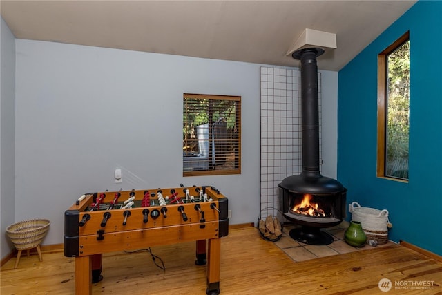 251 Saddle Dr, Port Townsend, WA 98368 - rec room with a wood stove and wood finished floors