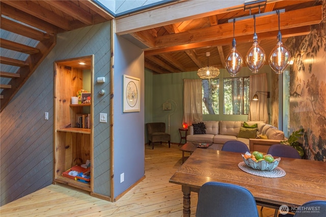 251 Saddle Dr, Port Townsend, WA 98368 - dining space with light wood-style flooring, wooden walls, stairs, a skylight, and wooden ceiling