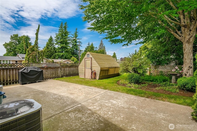 1021 Garden Dr, Lynden, WA 98264 - fenced backyard with a storage shed, a patio area, and area for grilling