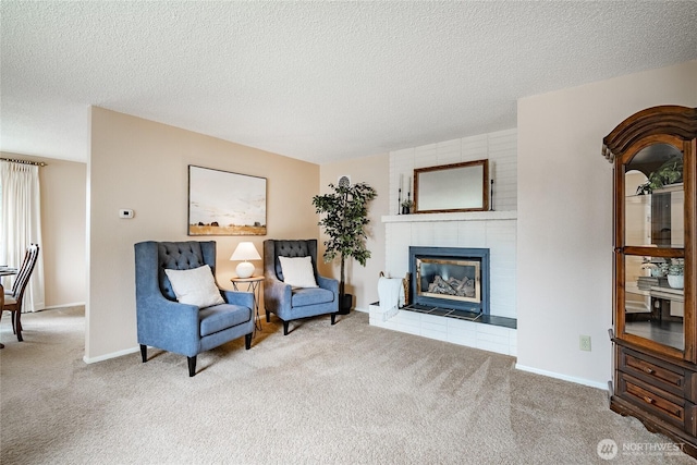 1021 Garden Dr, Lynden, WA 98264 - living area with carpet flooring, a textured ceiling, and a tile fireplace