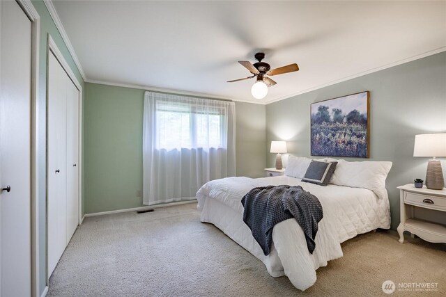 1021 Garden Dr, Lynden, WA 98264 - bedroom featuring ornamental molding, carpet flooring, a ceiling fan, and a closet