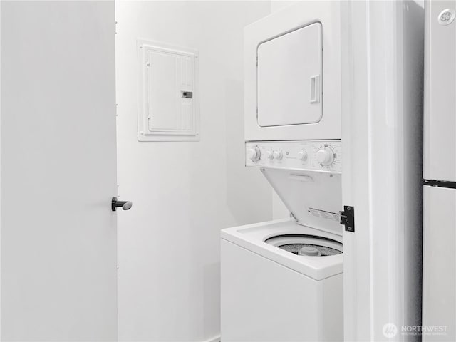 1111 E Pike St Unit 205, Seattle, WA 98122 - laundry room featuring stacked washer and clothes dryer and electric panel