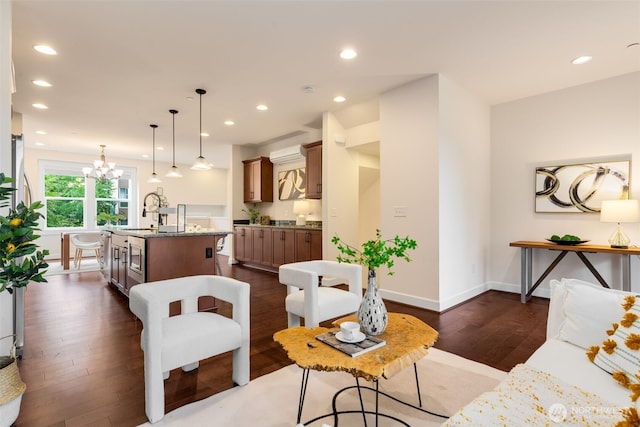 1087 10th Ave NE, Issaquah, WA 98029 - living room with dark wood-type flooring, a chandelier, and recessed lighting