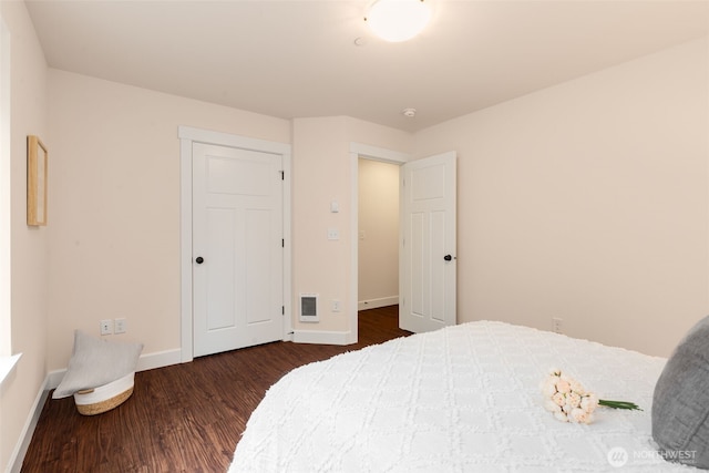 1087 10th Ave NE, Issaquah, WA 98029 - bedroom with baseboards and dark wood-type flooring