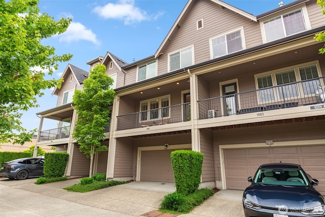 1087 10th Ave NE, Issaquah, WA 98029 - view of property with an attached garage, concrete driveway, and a balcony