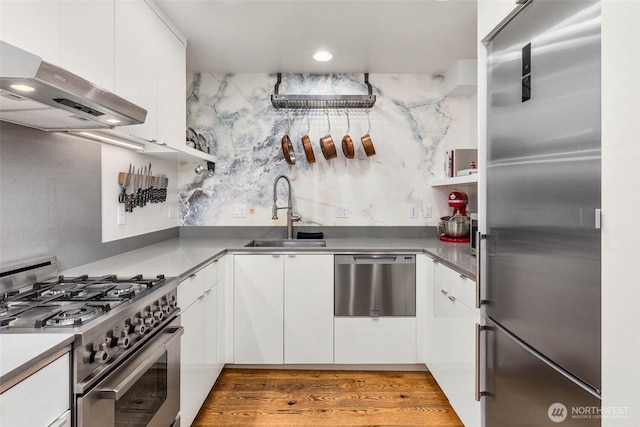 866 NE 96th St, Seattle, WA 98115 - kitchen featuring premium appliances, under cabinet range hood, white cabinets, open shelves, and modern cabinets