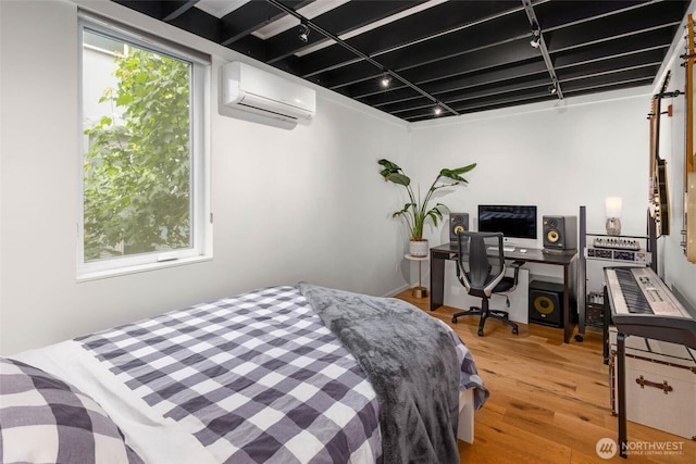 866 NE 96th St, Seattle, WA 98115 - bedroom with an AC wall unit, track lighting, and wood finished floors