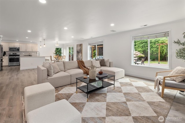 14219 284th Pl NE, Duvall, WA 98019 - living room featuring recessed lighting and light wood finished floors