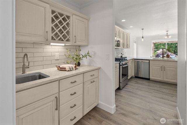 14219 284th Pl NE, Duvall, WA 98019 - kitchen with appliances with stainless steel finishes, backsplash, crown molding, light wood-style flooring, and recessed lighting