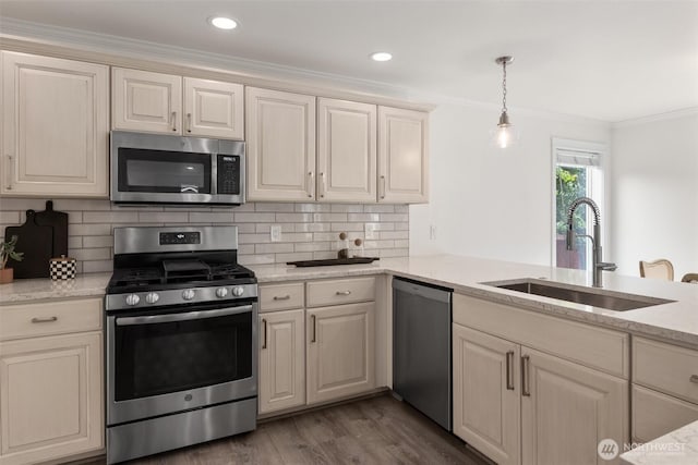 14219 284th Pl NE, Duvall, WA 98019 - kitchen with appliances with stainless steel finishes, crown molding, backsplash, wood finished floors, and pendant lighting