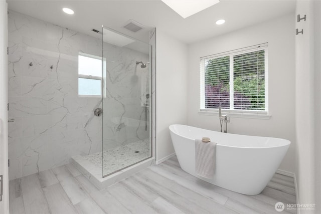 14219 284th Pl NE, Duvall, WA 98019 - full bathroom featuring a marble finish shower, a soaking tub, a skylight, and recessed lighting