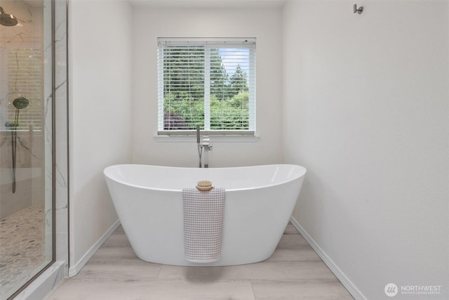 14219 284th Pl NE, Duvall, WA 98019 - bathroom featuring a stall shower and a freestanding tub
