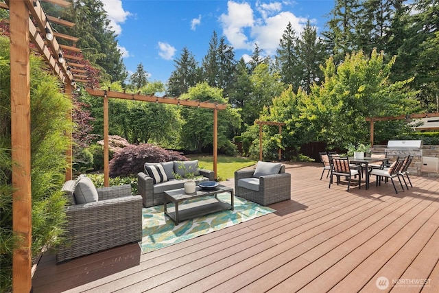 14219 284th Pl NE, Duvall, WA 98019 - wooden terrace featuring outdoor lounge area, outdoor dining space, view of scattered trees, and an outdoor kitchen