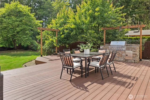 14219 284th Pl NE, Duvall, WA 98019 - deck with an outdoor kitchen, a fenced backyard, and outdoor dining area