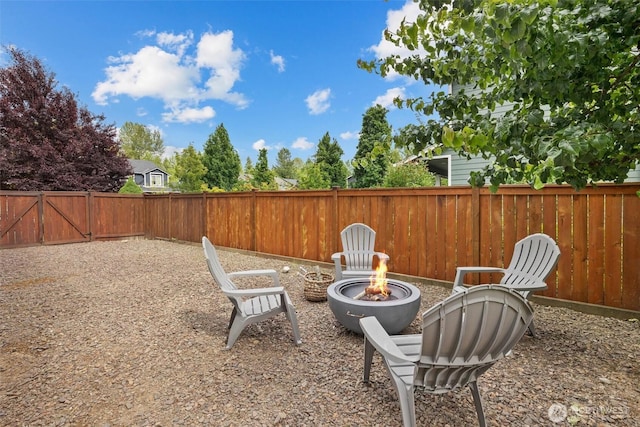 14219 284th Pl NE, Duvall, WA 98019 - fenced backyard with a fire pit