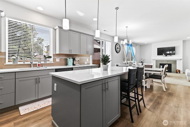 202 191st Street Ct E, Spanaway, WA 98387 - kitchen with gray cabinetry, recessed lighting, light countertops, and wood finished floors