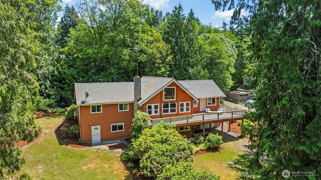 12170 Viewcrest Pl NE, Bainbridge Island, WA 98110 - rear view of house featuring a deck and a yard