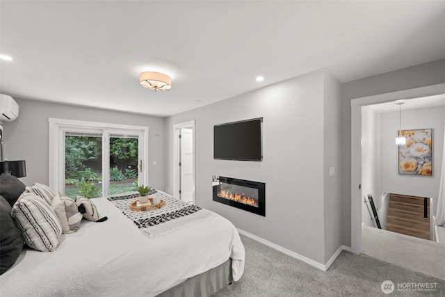 12170 Viewcrest Pl NE, Bainbridge Island, WA 98110 - carpeted bedroom with a glass covered fireplace, recessed lighting, and an AC wall unit