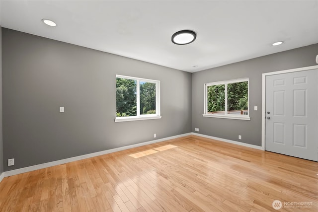 12170 Viewcrest Pl NE, Bainbridge Island, WA 98110 - empty room featuring light wood-type flooring and recessed lighting